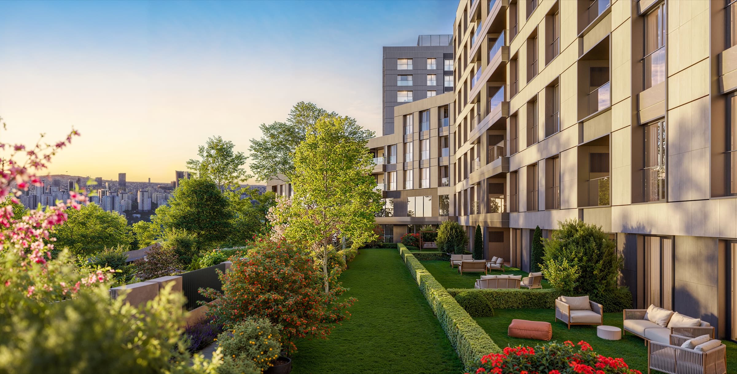 Garden terrace at Ataşehir 173, with lawn, clipped hedging and outdoor lounge seating along the façade, the city spread out beyond