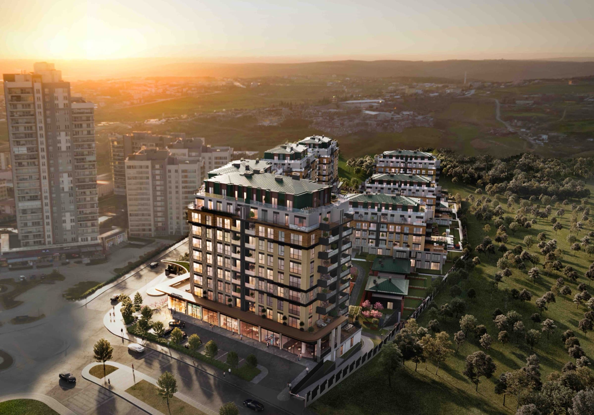 Aerial render of Ebruli Kayaşehir at sunset: the nine blocks stepping down their slope with planted roof terraces, the low social building at their centre, and open parkland running away toward the horizon