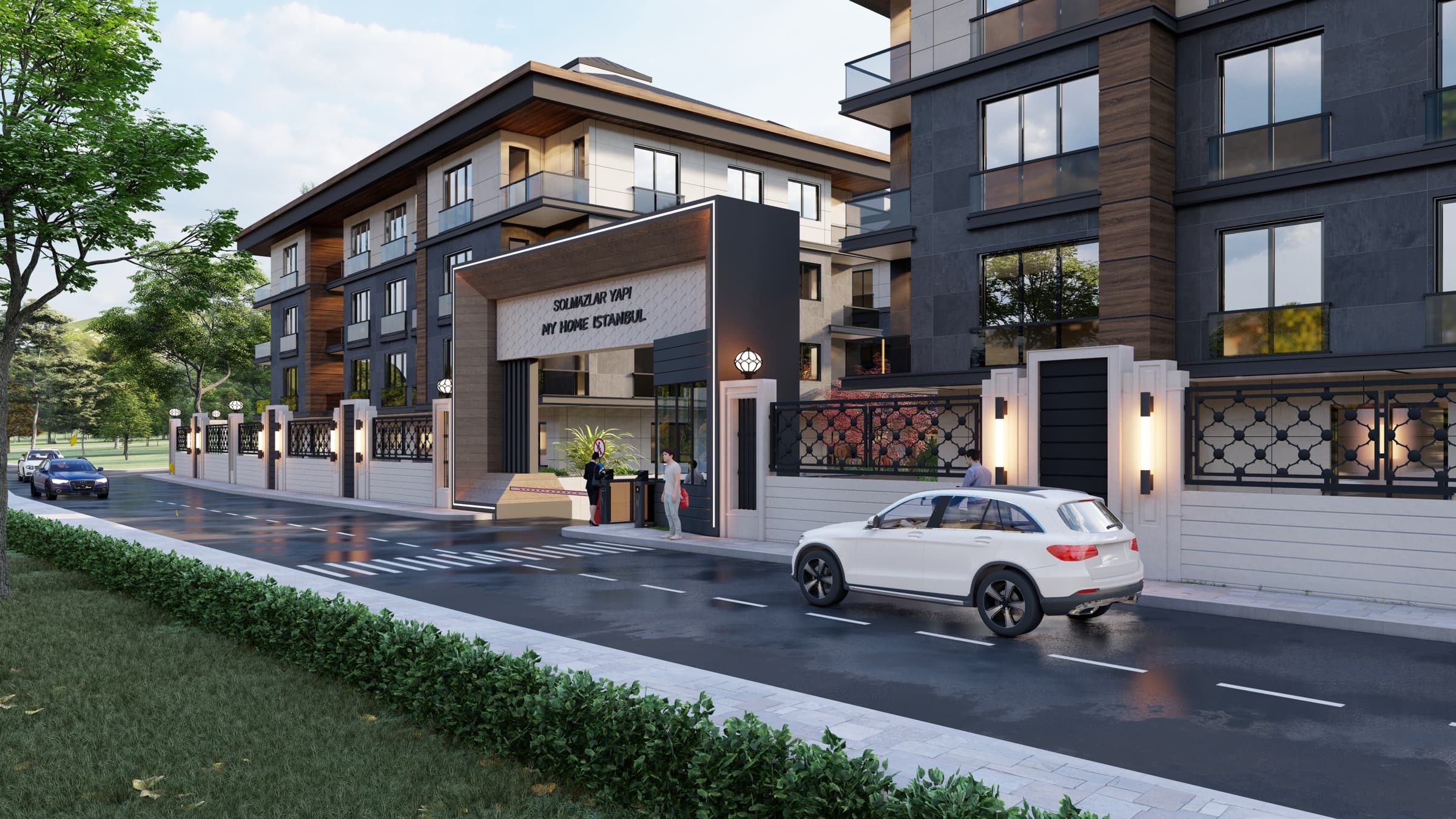 المدخل المسوَّر لـ My Home İstanbul: مظلّة مضاءة تحمل اسمَي Solmazlar Yapı و My Home İstanbul فوق كشك حراسة يقف فيه موظف وبوابة دوّارة، وسور الشارع تعلوه مشبّكات معدنية مزخرفة، وسيارة بيضاء تمرّ على الطريق — صورة تخيلية