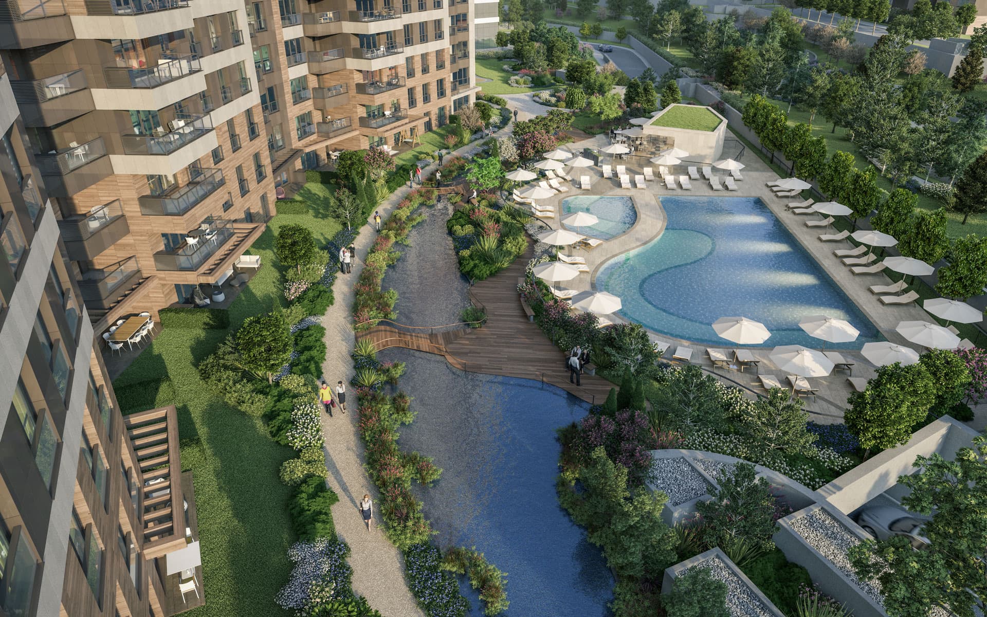 Aerial view over Nidapark Küçükyalı's landscaped courtyard, where a planted stream and a curved outdoor pool with sun loungers run between the apartment blocks. Artist's impression.