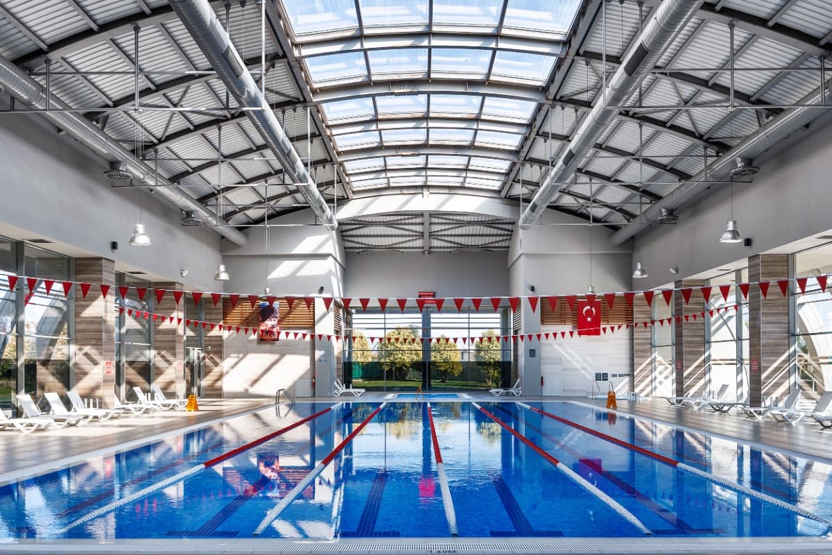 Indoor lap pool under a glazed barrel roof at Tema İstanbul, Küçükçekmece, Istanbul