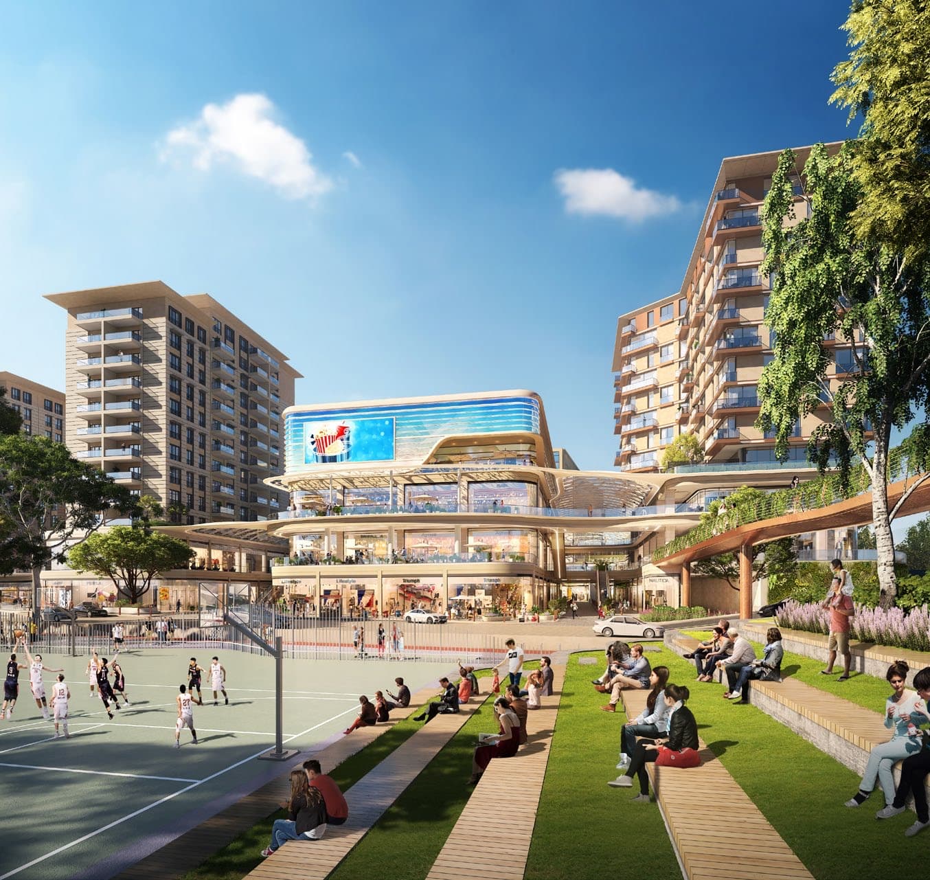 Wider computer-generated view of the same basketball court and stepped lawn seating terraces filled with people, facing the curved shopping centre with its large media screen and the residential blocks either side — artist's impression