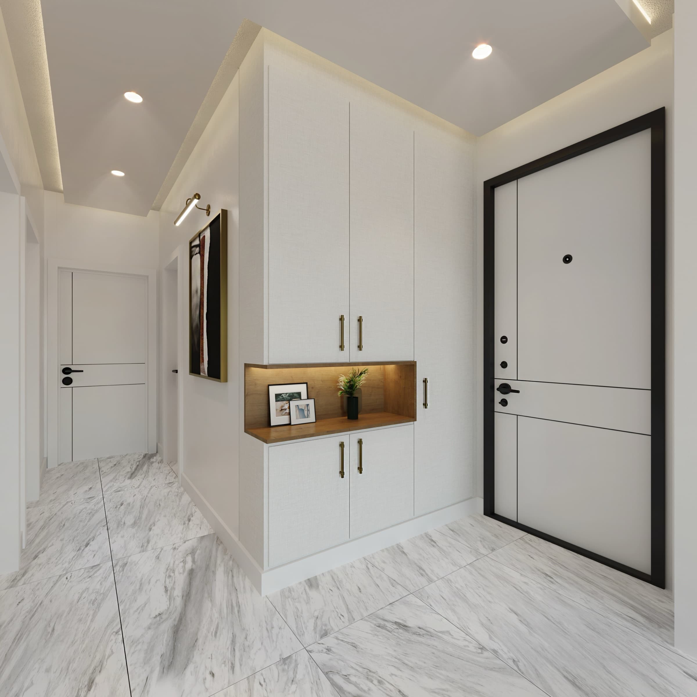 The entrance hall of a Venara Güneşli apartment: the front door set in a black frame, full-height fitted joinery with brass handles around a lit oak display niche, and veined white marble tiling running through to the inner rooms.