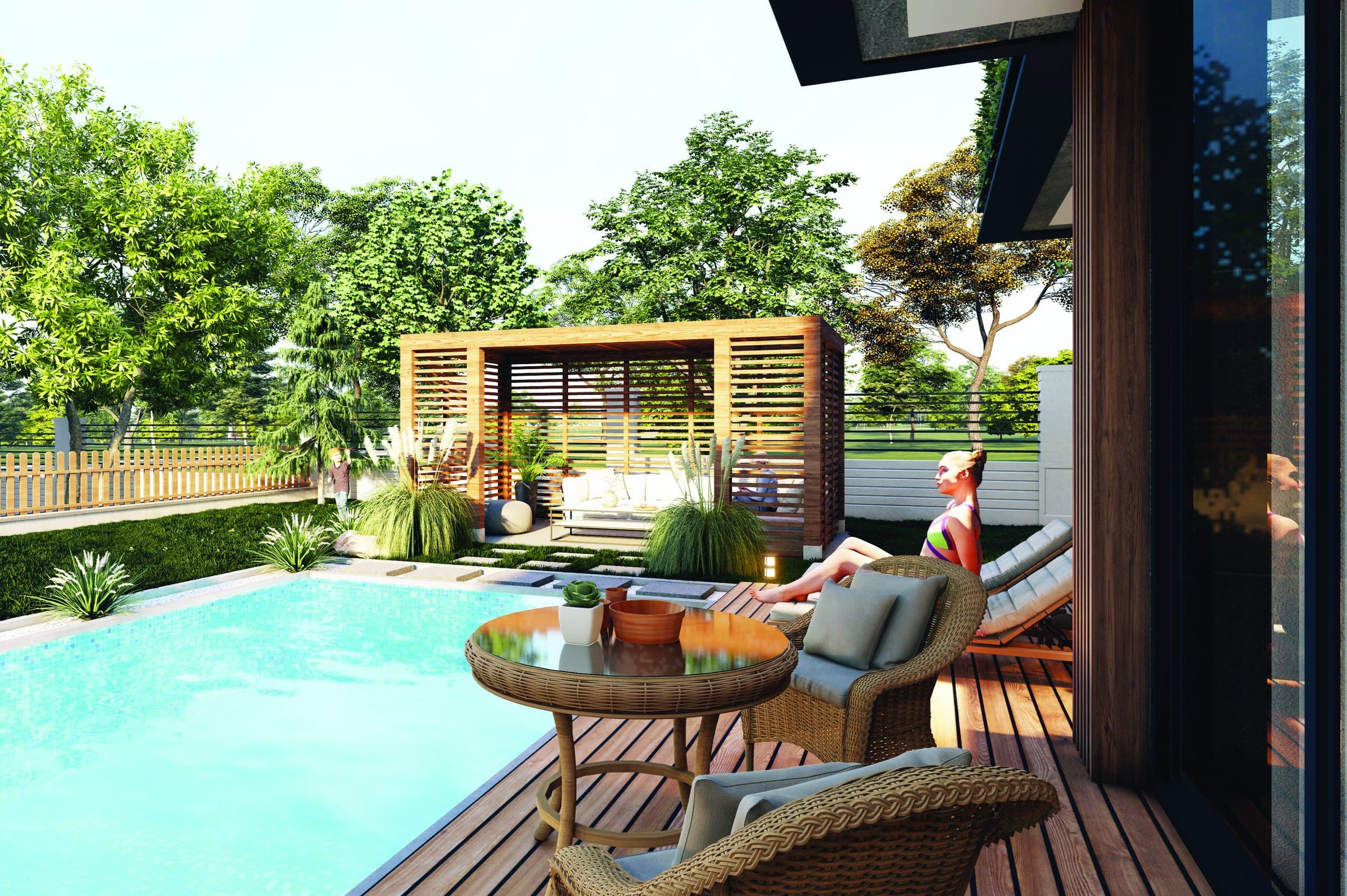 Computer-generated view across the private pool to a timber pergola with a seating group beneath it, and the villa's glazed ground floor behind — artist's impression