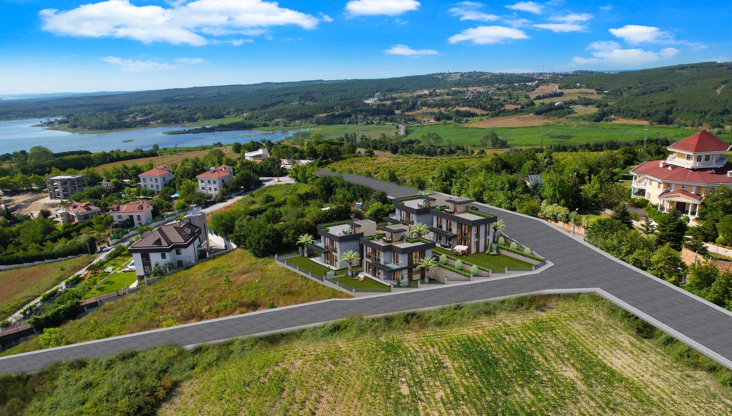 A wide aerial view over Durusu with Yeşilce Villaları at its centre, the Terkos lake reaching away to the left past reed beds and tree belts, village houses and a large red-roofed mansion to the right and cultivated fields in the foreground — artist's impression