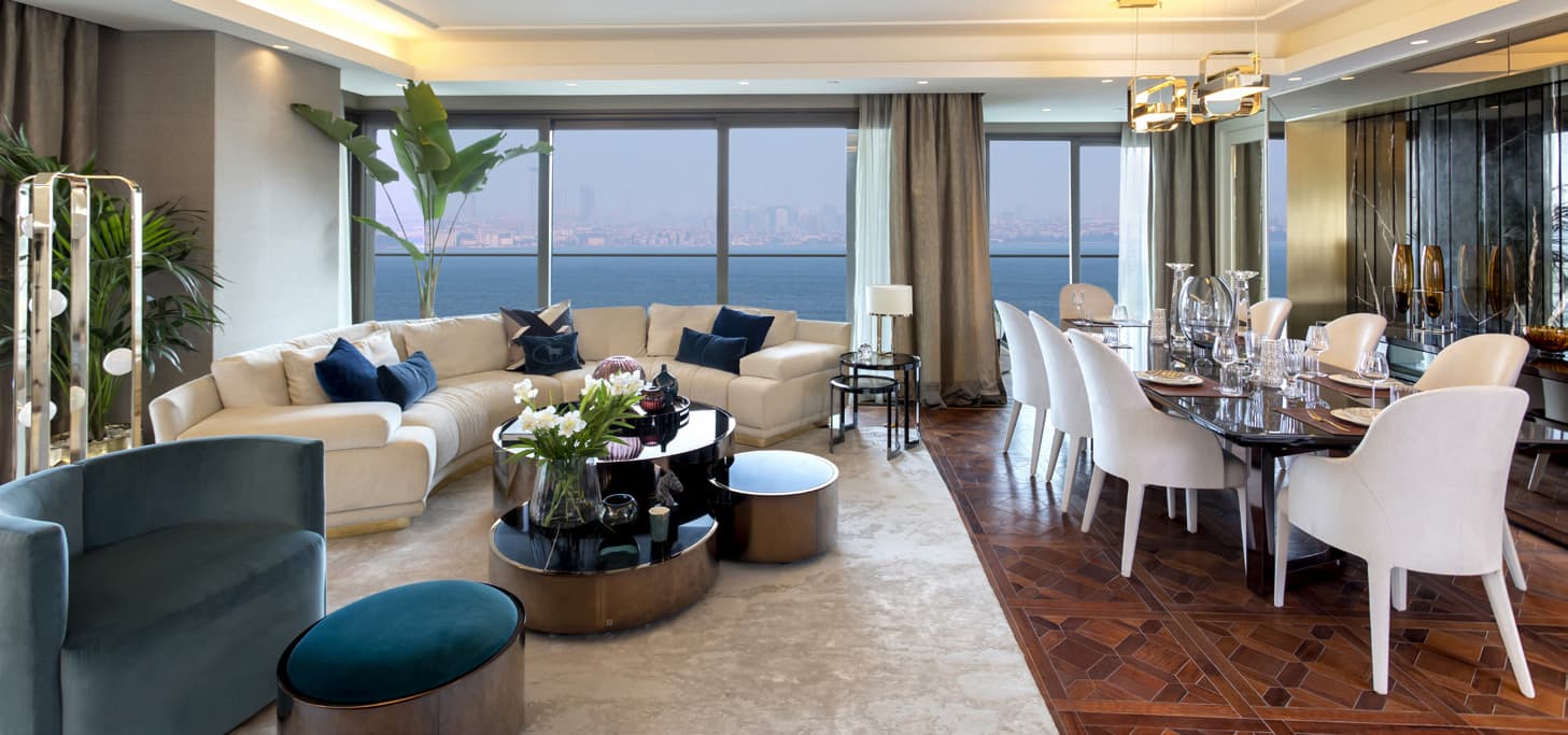 Living and dining room of a delivered Fendi Casa residence, with panoramic windows onto the Sea of Marmara and the Istanbul skyline